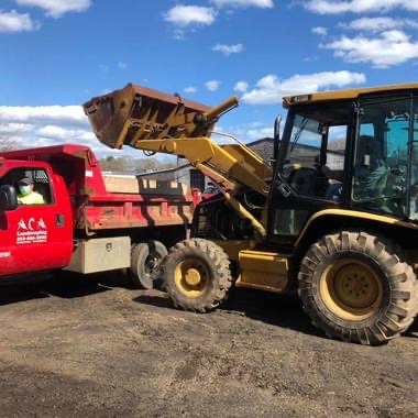 Loader loading mulch